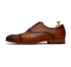 
                  
                    tan calf leather lace up dress shoes with burnished toe.
                  
                