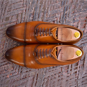 
                  
                    tan calf leather lace up dress shoes with burnished toe.
                  
                
