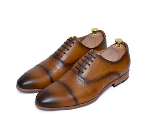 
                  
                    tan calf leather lace up oxford shoes with burnished toe.
                  
                