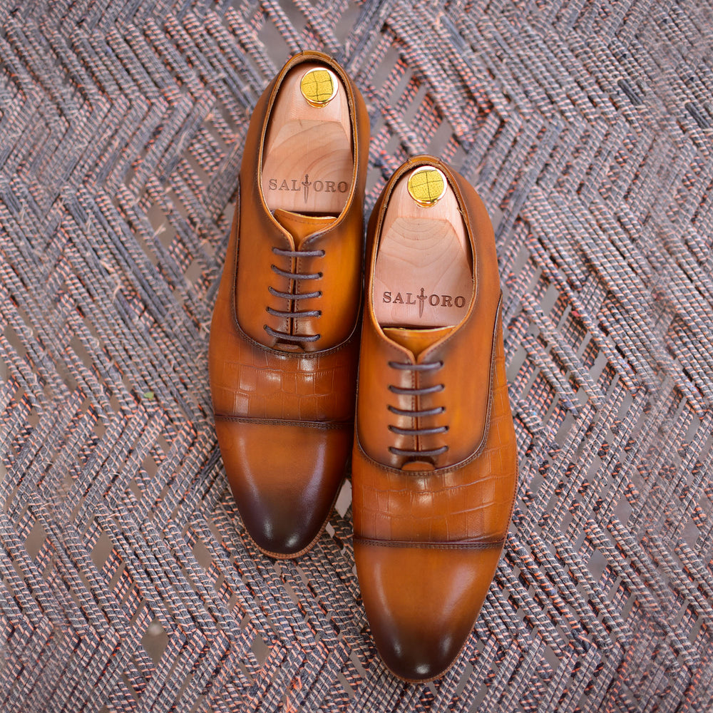 
                  
                    tan calf leather lace up dress shoes with burnished toe.
                  
                