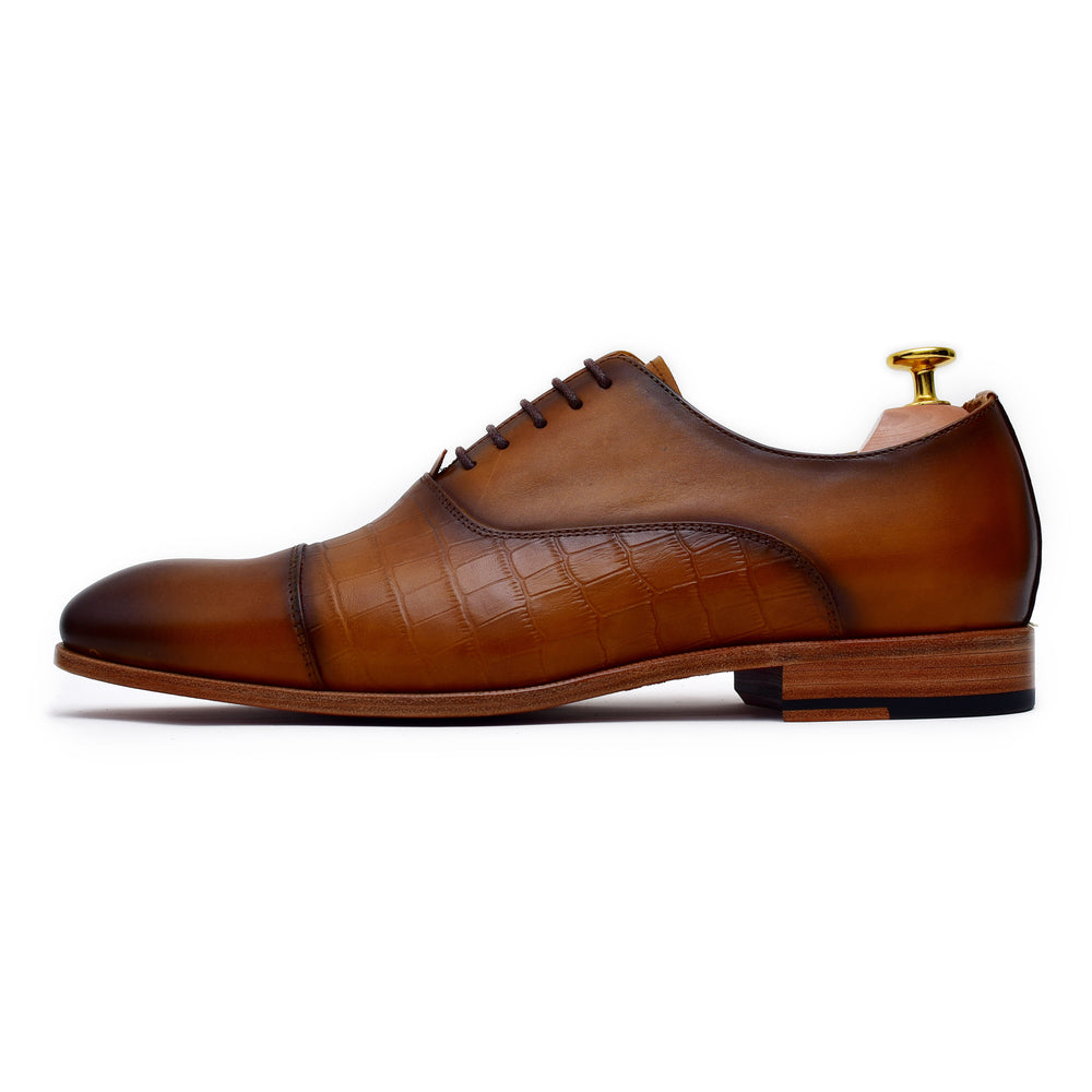 
                  
                    tan calf leather lace up dress shoes with burnished toe.
                  
                